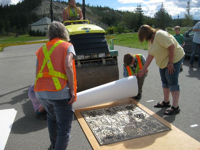 Printing from the woodblock - using a road packer!